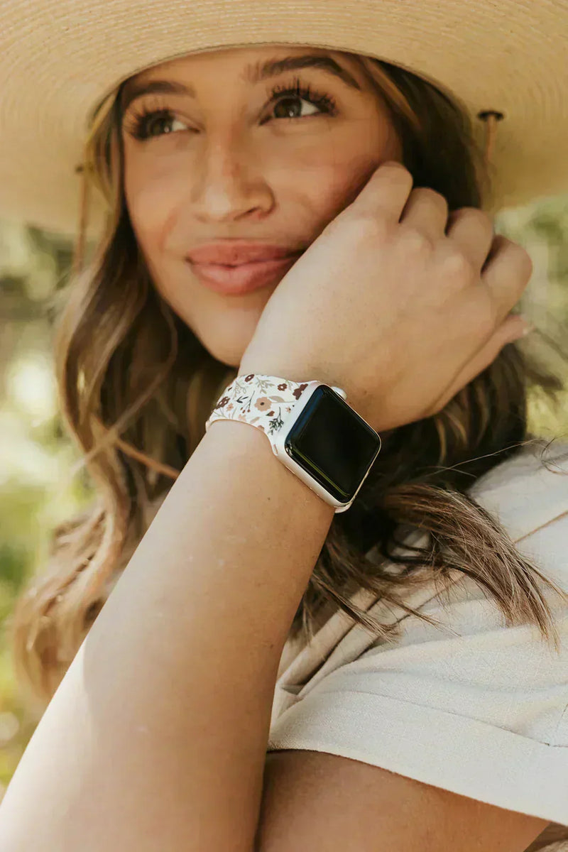 Woman wearing a stylish Walli Apple Watch band while using her Apple Watch during everyday activities.