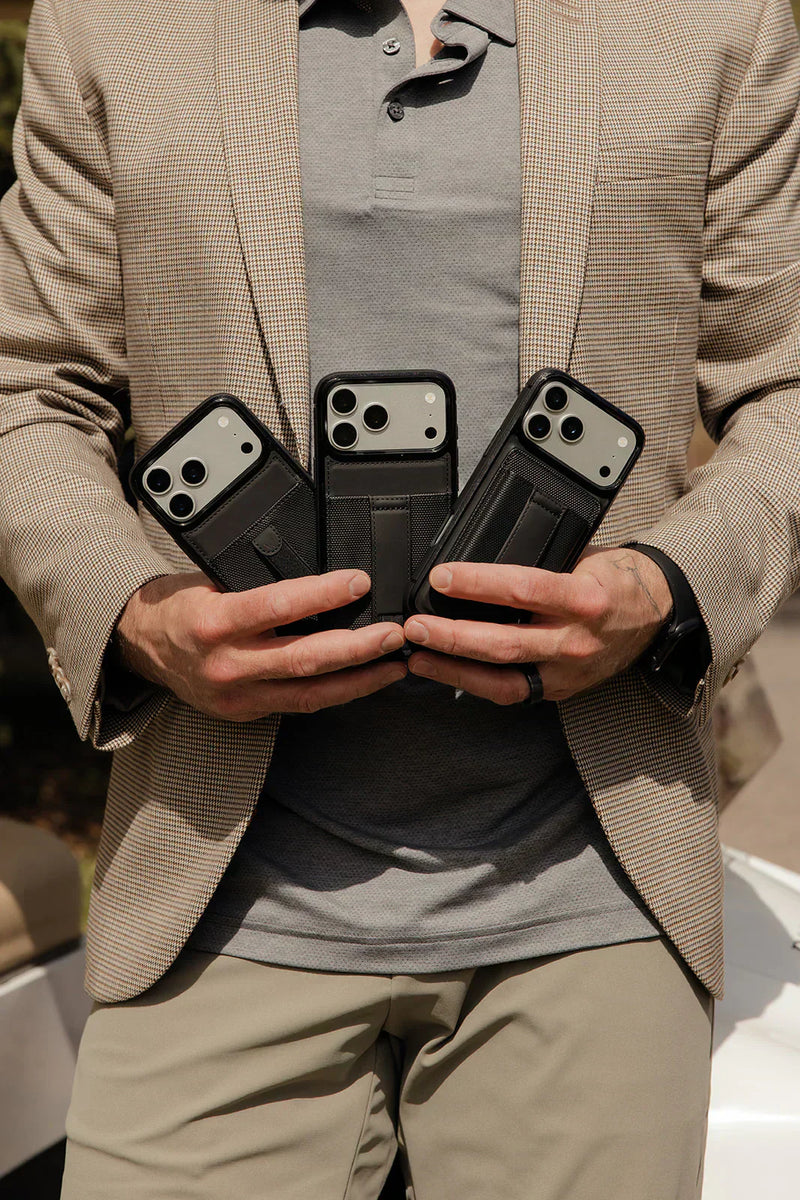 Person holding three Walli MagSafe-compatible phone cases with matching magnetic wallets attached to showcase slim everyday carry.